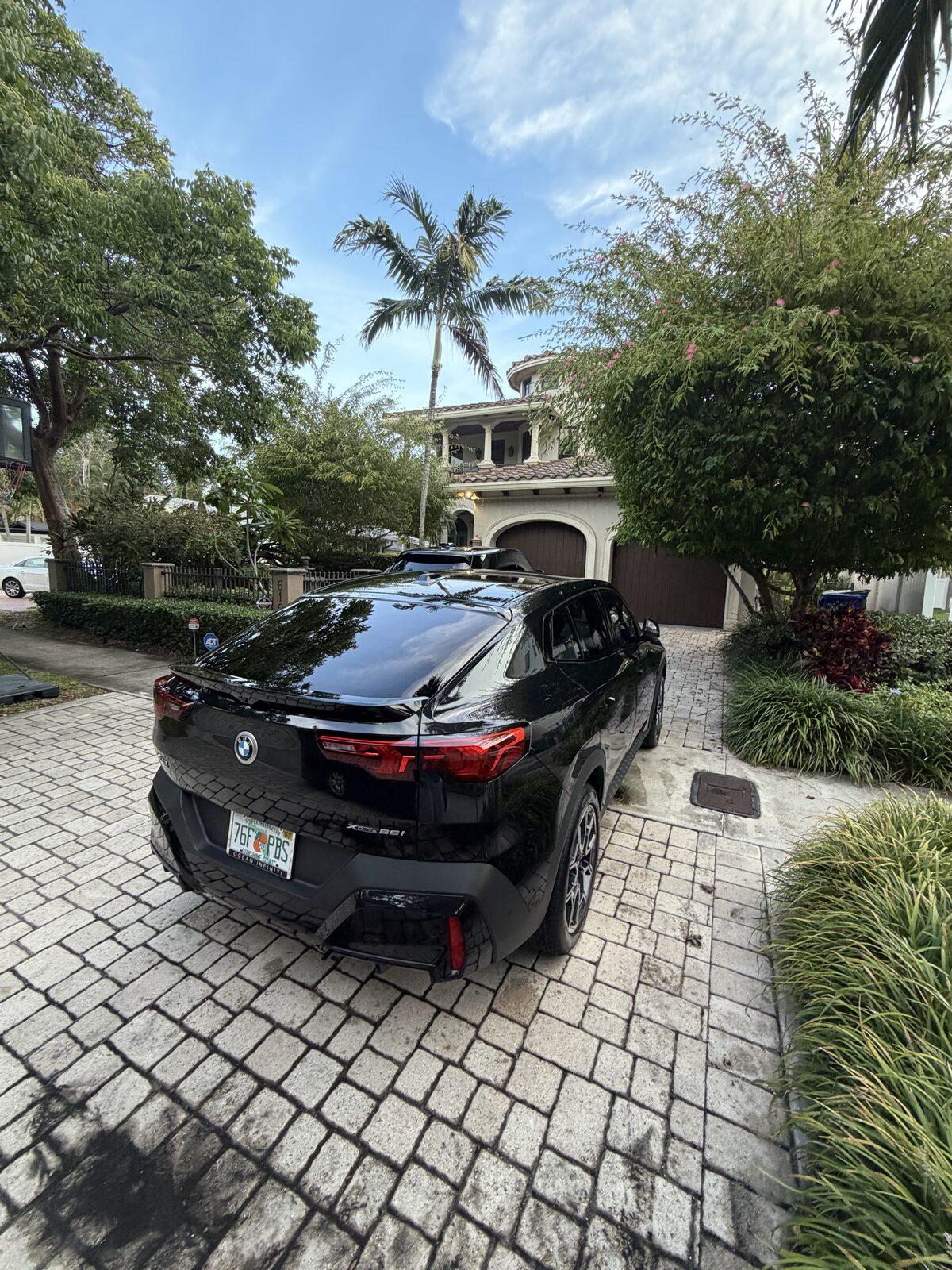 BMW X6 — blacked-out exterior detail, South Florida driveway