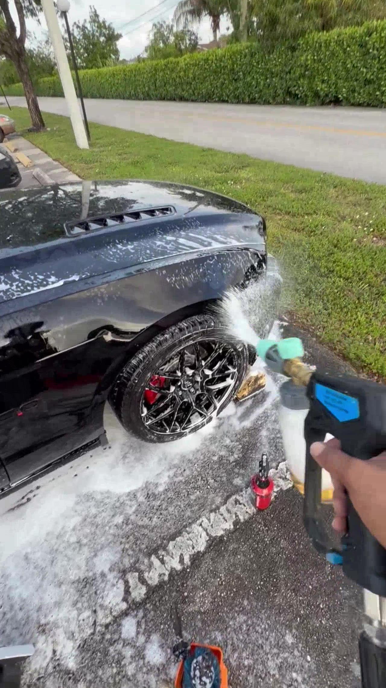 Foam cannon on Mustang wheel and fender